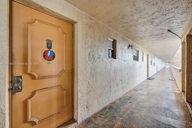 view of exterior entry with stucco siding