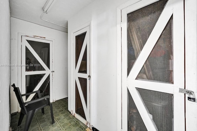 exterior space with tile patterned floors and a heating unit