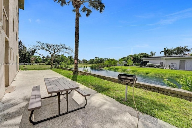 view of patio with a water view