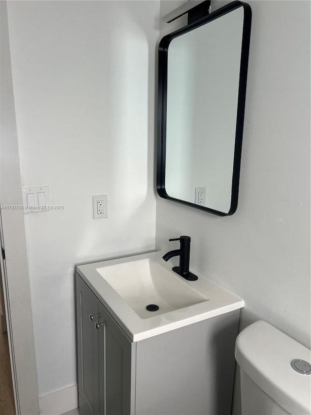half bath with toilet and vanity