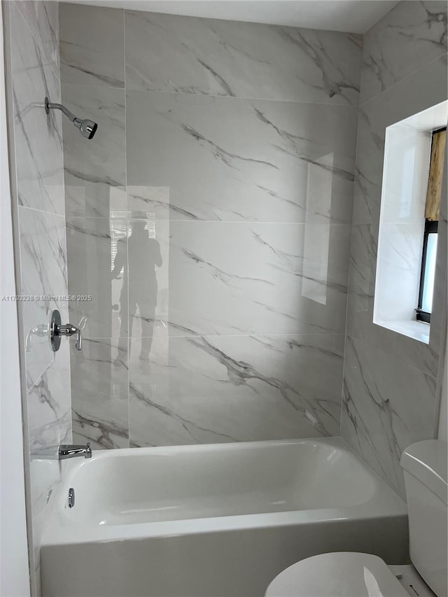 full bath featuring washtub / shower combination and toilet