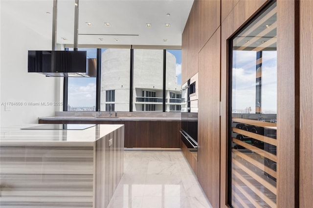17141 Collins Ave Unit 3002, Sunny Isles Beach, FL 33160 - kitchen with plenty of natural light, modern cabinets, and marble finish floor