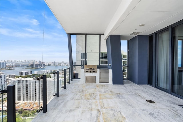 17141 Collins Ave Unit 3002, Sunny Isles Beach, FL 33160 - balcony featuring grilling area, an outdoor kitchen, a view of city, a water view, and visible vents