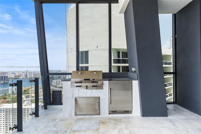 17141 Collins Ave Unit 3002, Sunny Isles Beach, FL 33160 - view of patio / terrace with grilling area, an outdoor kitchen, a water view, and a balcony