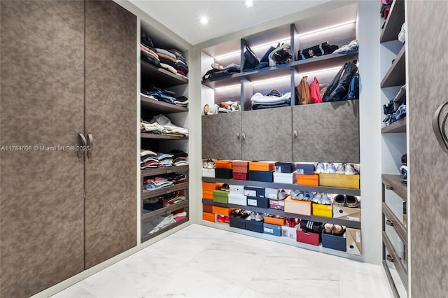 17141 Collins Ave Unit 3002, Sunny Isles Beach, FL 33160 - walk in closet featuring marble finish floor