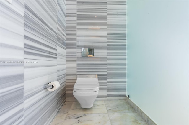 17141 Collins Ave Unit 3002, Sunny Isles Beach, FL 33160 - bathroom with toilet and marble finish floor