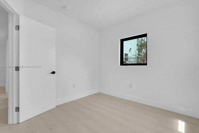 1814 NW 2nd Ct, Miami, FL 33136 - unfurnished room featuring light wood-style flooring and baseboards