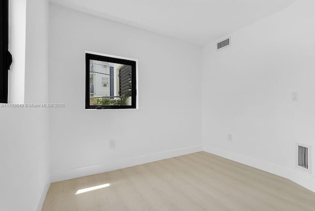 1814 NW 2nd Ct, Miami, FL 33136 - empty room with wood finished floors and baseboards