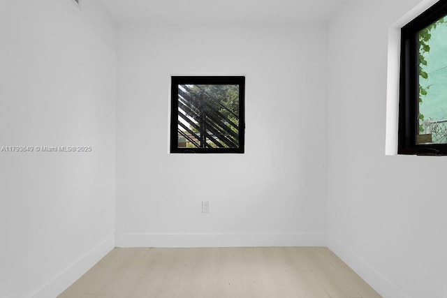 1814 NW 2nd Ct, Miami, FL 33136 - spare room with light wood finished floors, plenty of natural light, and baseboards