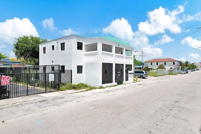 1814 NW 2nd Ct, Miami, FL 33136 - view of front of house with stucco siding and fence