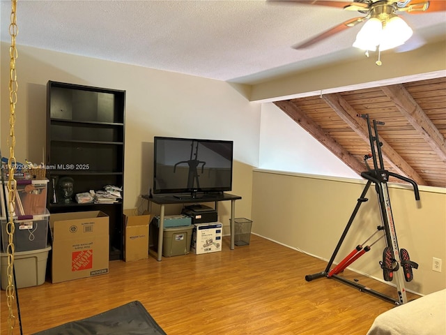 living room with a ceiling fan and wood finished floors