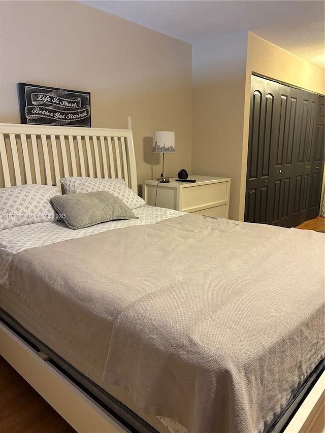 bedroom with a closet and wood finished floors