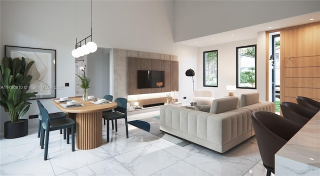 living area with a high ceiling, recessed lighting, and marble finish floor