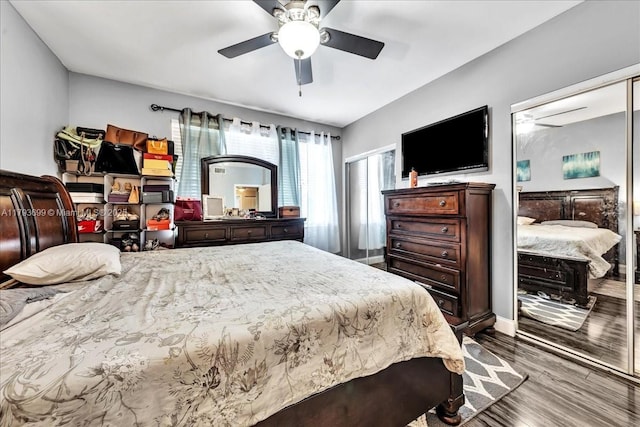 bedroom with baseboards, ceiling fan, and wood finished floors