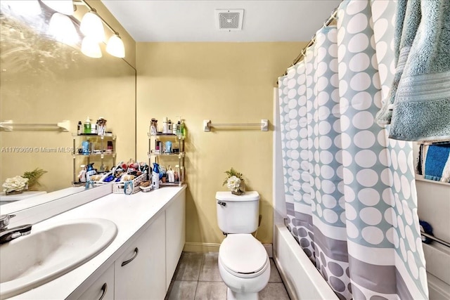full bath featuring vanity, toilet, tile patterned floors, baseboards, and visible vents