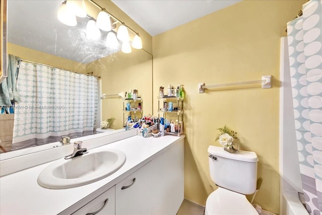 full bathroom featuring vanity and toilet