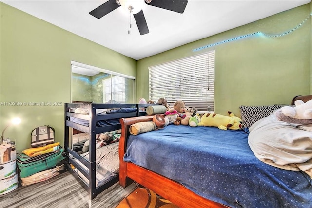 bedroom with a ceiling fan and wood finished floors