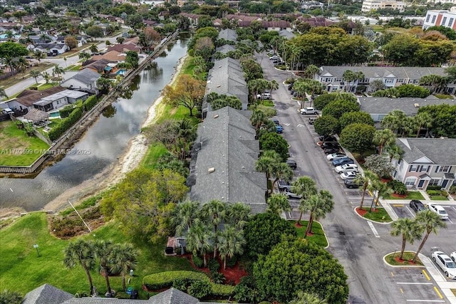bird's eye view with a water view and a residential view