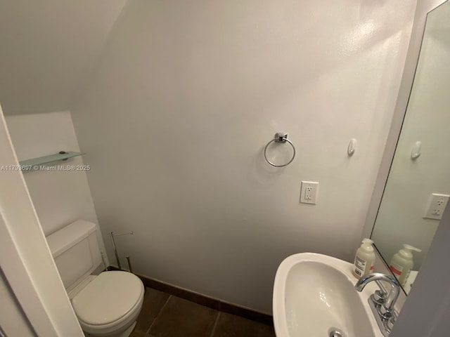 1525 Pennsylvania Ave Unit 5, Miami Beach, FL 33139 - bathroom featuring baseboards, a sink, tile patterned floors, and toilet