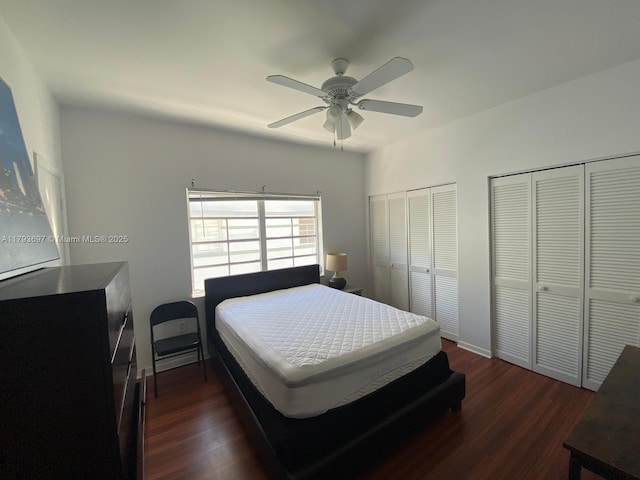 1525 Pennsylvania Ave Unit 5, Miami Beach, FL 33139 - bedroom featuring a ceiling fan, two closets, and dark wood finished floors