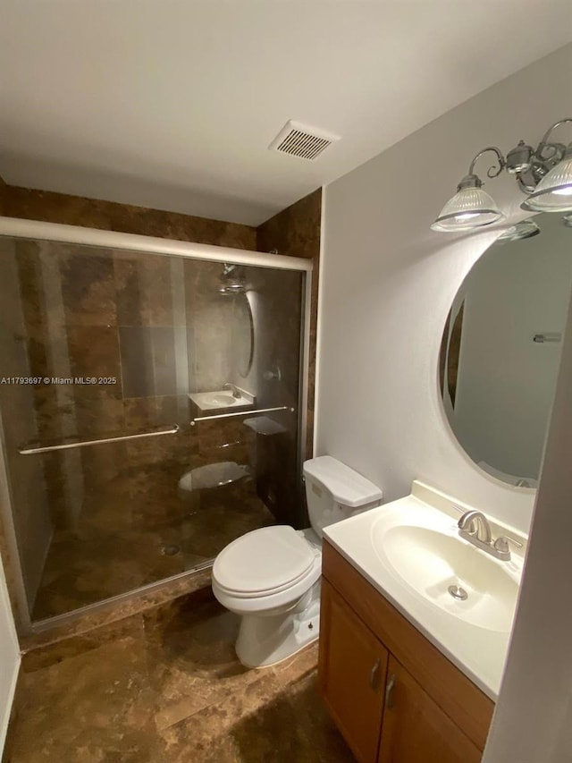 1525 Pennsylvania Ave Unit 5, Miami Beach, FL 33139 - full bathroom with toilet, a stall shower, visible vents, and vanity