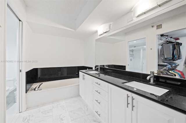 19101 NE 36th Ct Unit 2509, Aventura, FL 33180 - bathroom with a sink, toilet, marble finish floor, a bath, and a stall shower
