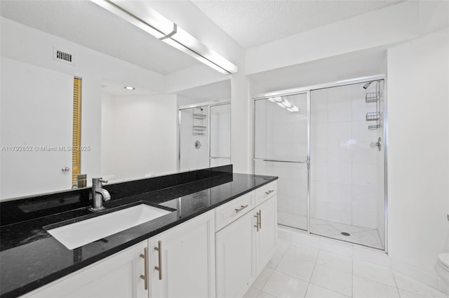 19101 NE 36th Ct Unit 2509, Aventura, FL 33180 - full bath with visible vents, a stall shower, vanity, tile patterned floors, and toilet
