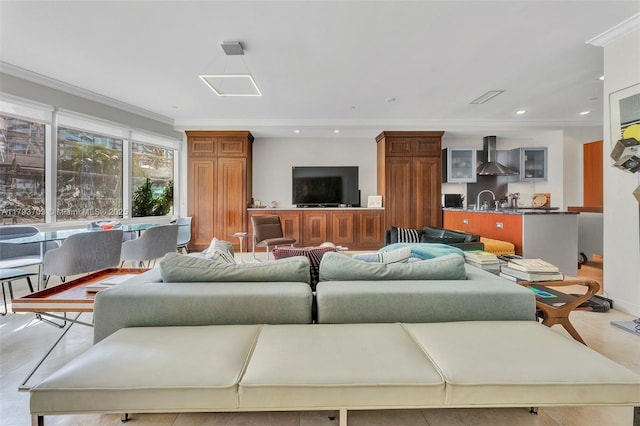 living room featuring recessed lighting and ornamental molding