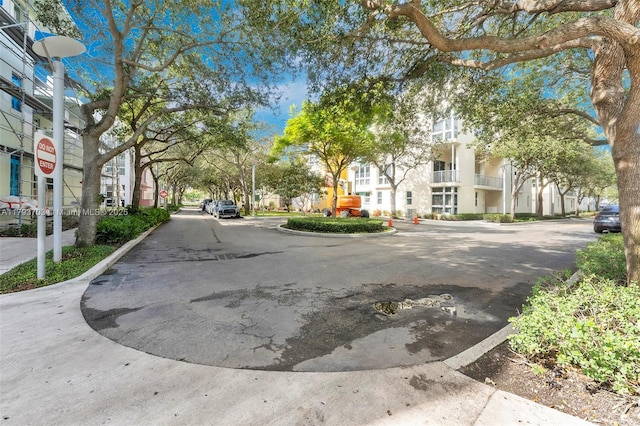 6101 Aqua Ave Unit 103, Miami Beach, FL 33141 - view of asphalt street with traffic signs, curbs, and sidewalks