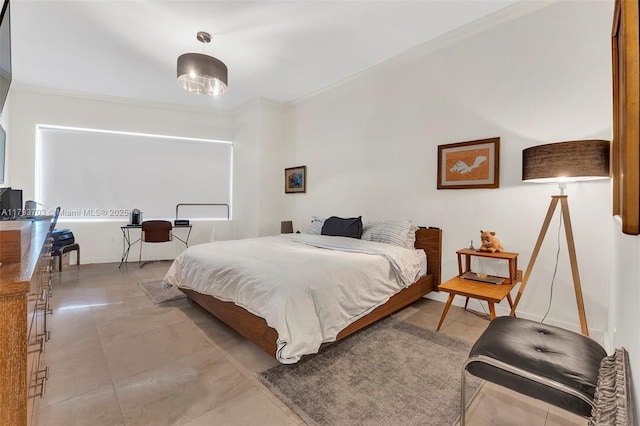 6101 Aqua Ave Unit 103, Miami Beach, FL 33141 - bedroom with ornamental molding and light tile patterned floors