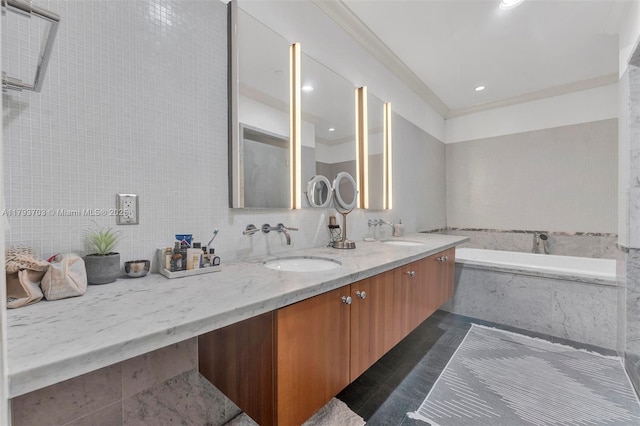 full bath with double vanity, a sink, a garden tub, and recessed lighting