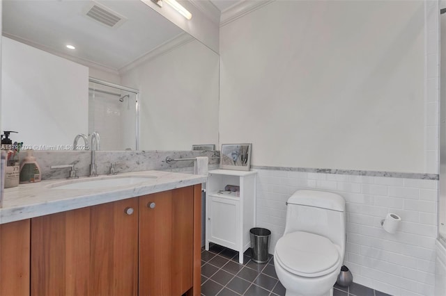 bathroom with visible vents, crown molding, tile walls, a stall shower, and tile patterned floors