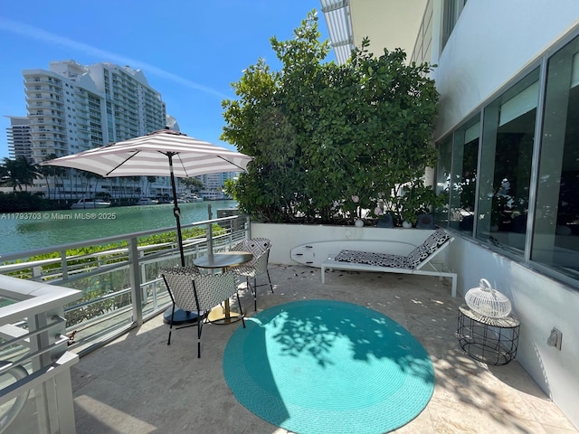 view of patio featuring a water view