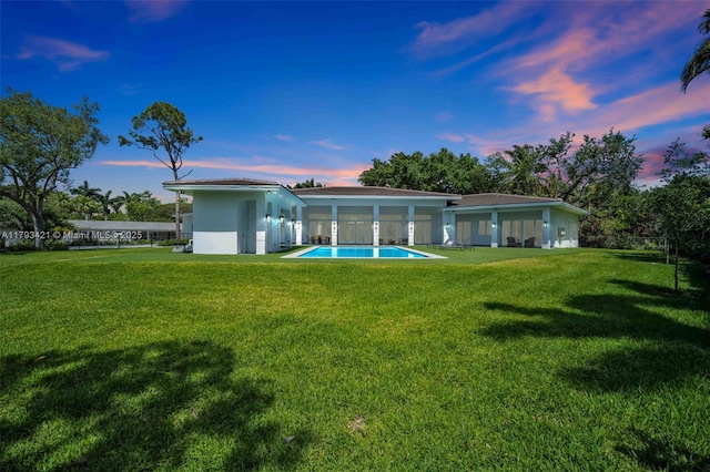 7900 SW 70th St, Miami, FL 33143 - rear view of property with a yard and stucco siding