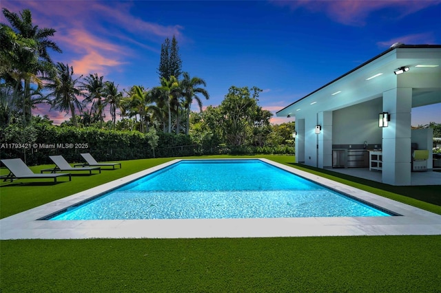 7900 SW 70th St, Miami, FL 33143 - view of pool with a yard, an outdoor kitchen, and a patio area