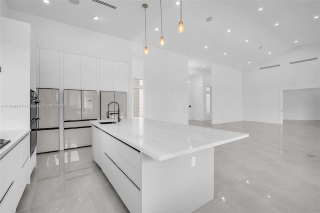 7900 SW 70th St, Miami, FL 33143 - kitchen with modern cabinets, high vaulted ceiling, white cabinets, a spacious island, and pendant lighting