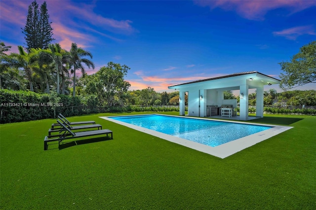 7900 SW 70th St, Miami, FL 33143 - pool at dusk featuring exterior kitchen, a gazebo, and a patio
