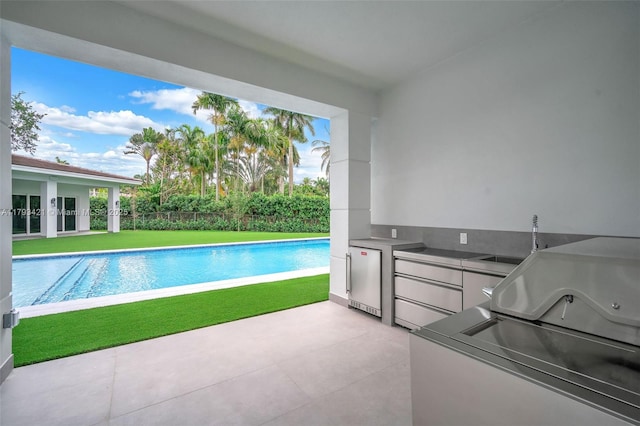 7900 SW 70th St, Miami, FL 33143 - view of swimming pool featuring area for grilling, a yard, and a patio area