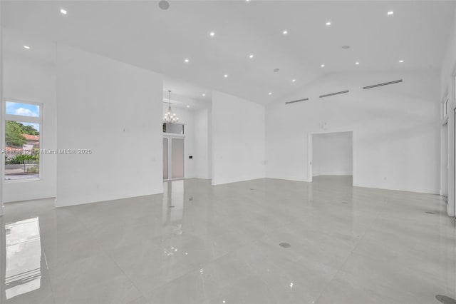 7900 SW 70th St, Miami, FL 33143 - empty room with high vaulted ceiling, a chandelier, and recessed lighting