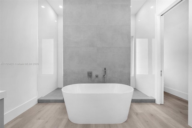 7900 SW 70th St, Miami, FL 33143 - bathroom featuring wood finished floors, a soaking tub, vanity, and recessed lighting