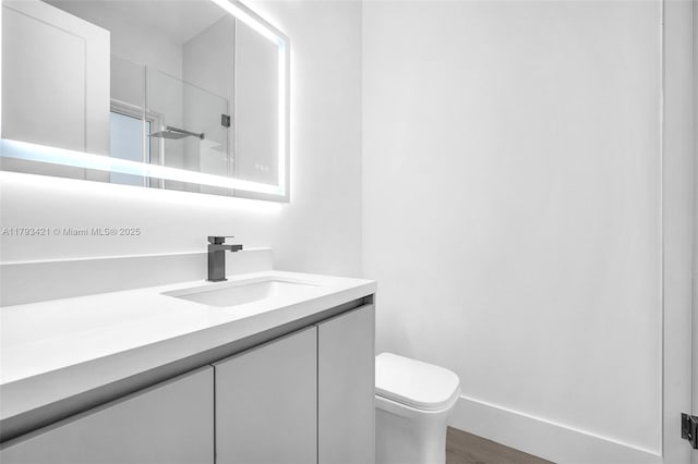 7900 SW 70th St, Miami, FL 33143 - full bath featuring vanity, wood finished floors, and a shower with shower door