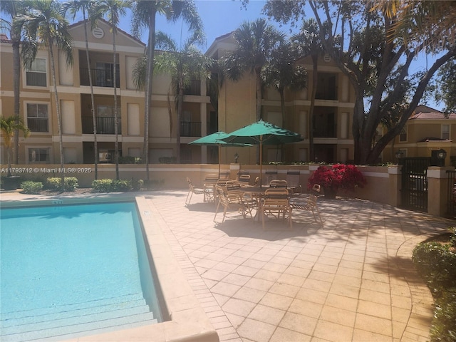 community pool with a patio area
