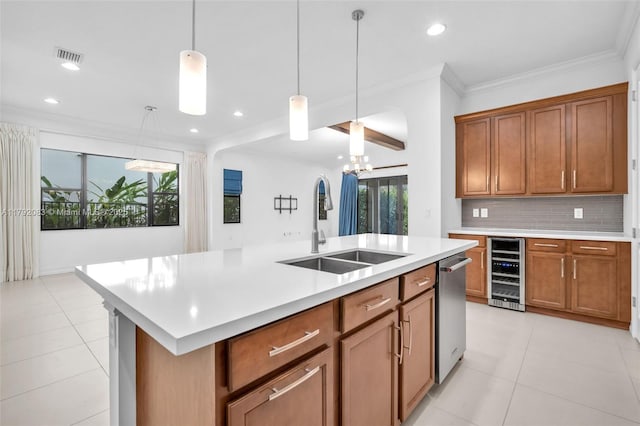 kitchen featuring wine cooler, light countertops, an inviting chandelier, and a sink