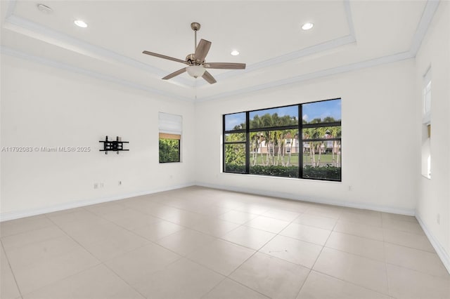 tiled spare room featuring crown molding, a raised ceiling, ceiling fan, and recessed lighting