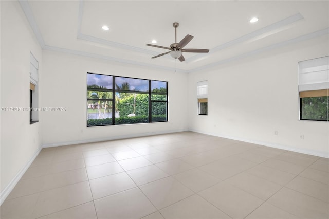 tiled spare room featuring crown molding, a ceiling fan, recessed lighting, and a raised ceiling