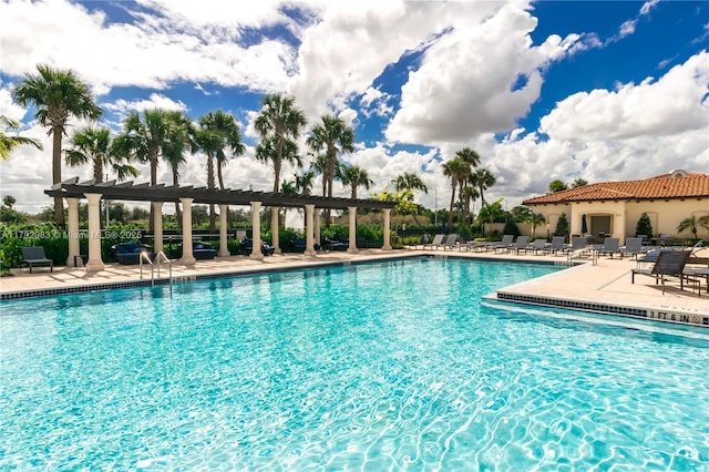 pool featuring a patio area and a pergola