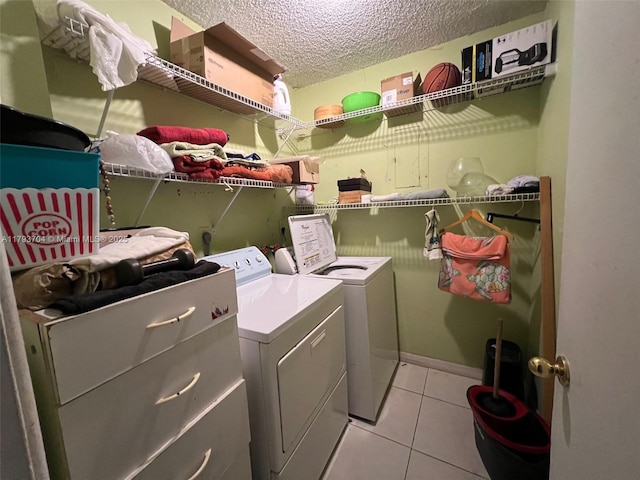460 W Park Dr Unit 103, Miami, FL 33172 - clothes washing area with laundry area, a textured ceiling, light tile patterned floors, and washing machine and clothes dryer