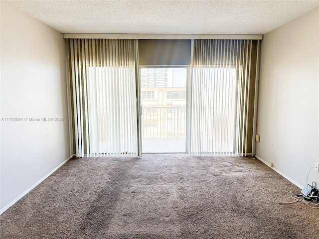 1950 S Ocean Dr Unit 3K, Hallandale Beach, FL 33009 - spare room with carpet flooring and a textured ceiling