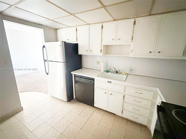 1950 S Ocean Dr Unit 3K, Hallandale Beach, FL 33009 - kitchen with a sink, light countertops, freestanding refrigerator, black dishwasher, and white cabinetry