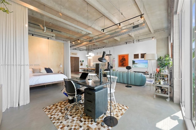office space featuring a high ceiling and finished concrete floors